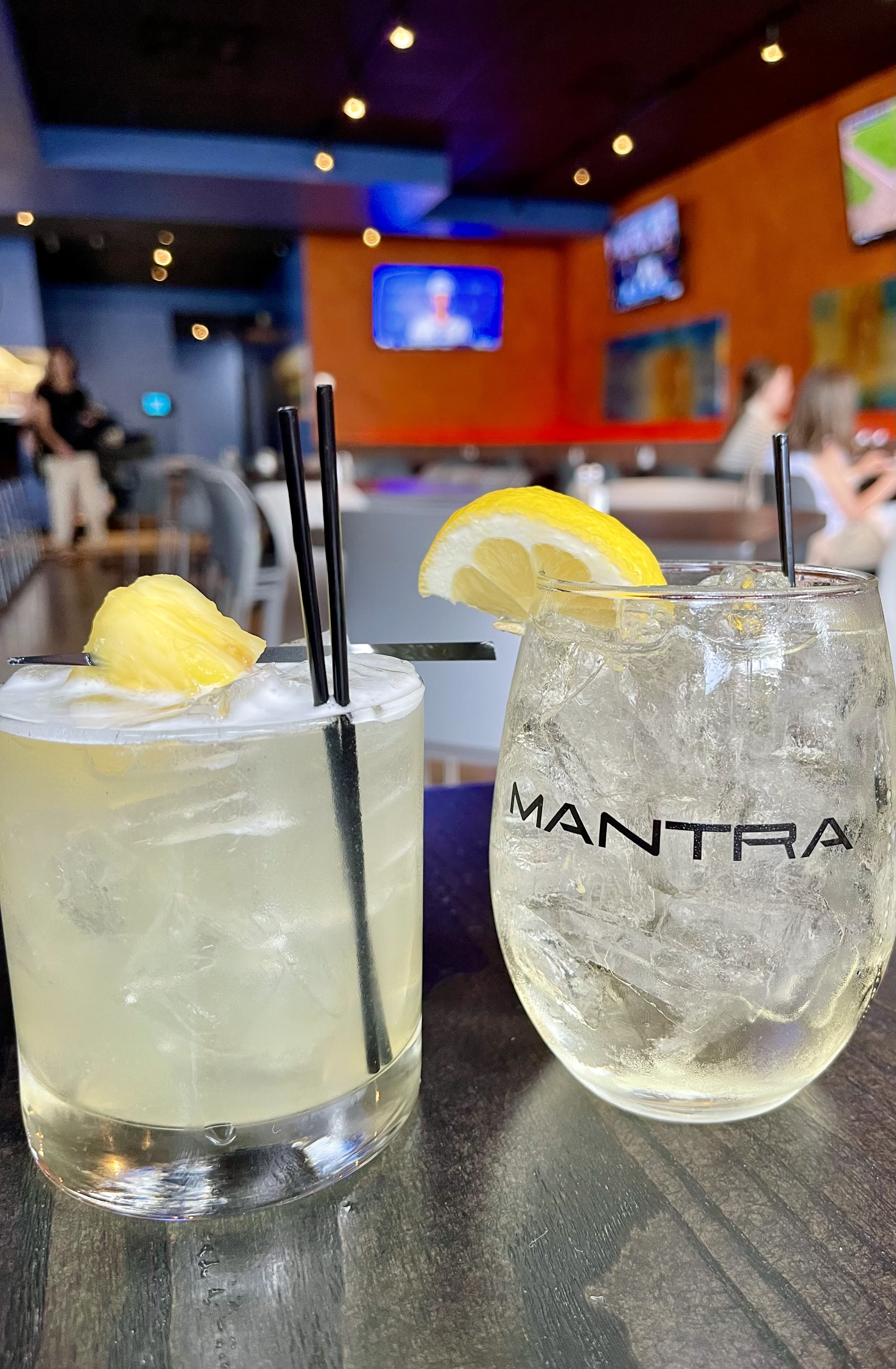 Two Mantra cocktails at the bar
